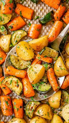 a spoon full of roasted potatoes and carrots