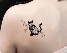 a woman with a cat tattoo on her back