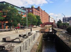 there are benches along the side of the river