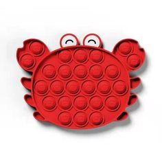 a red crab shaped cake pan with eyes