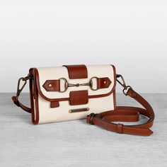 Transform your style with our luxurious leather accessories. From elegant bags and rugged bracelets to classic chokers, our collection offers timeless sophistication. Browse now! Rodeo Chic, Lunch Pail, Cowhide Handbags, Brown Cowhide, Vanity Bag, Zipper Pouches, Street Smart, Horse Bits, Leather Crossbody Purse