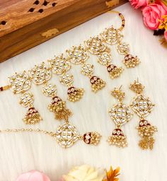 Simple and colorful with beautiful meenakari work! This kundan choker set comes with matching jhumka, tikka and is in gold and multi tones with meenakari work. it is beautifully handmade and is perfect for any party or event!  Gold plating and delicate and dainty colorful bead stones make it a beautiful piece that will look great with any color outfit! This lightweight and elegant necklace is perfect for any bridesmaid, bride, sangeet or any occasion or event as a gift for any occasion as any one who loves jewelry will love this statement piece. It has beautiful colors that really make the set a statement piece. Product Details: * Necklace - Comes with adjustable string * Earrings  * Maang Tikka Free Shipping/Ready to Ship and available immediately if you place an order today! Fast and Fre Kundan Choker Set, String Earrings, Light Jewelry, Kundan Choker, Dainty Choker, Choker Set, Elegant Necklace, Pakistani Wedding, Modern Traditional