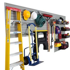 a garage with tools and equipment hanging on the wall