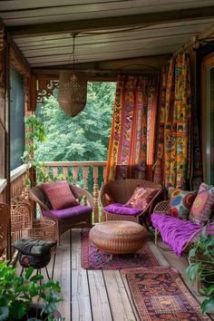 a porch with wicker furniture and colorful curtains