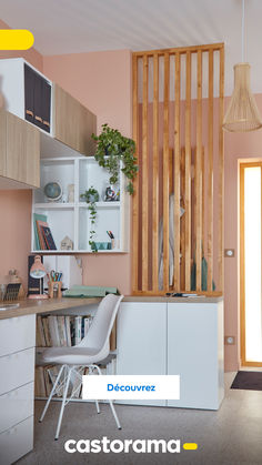 the interior of an apartment with pink walls and white furniture in front of a wooden divider