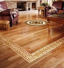 a living room filled with furniture and a fire place in the middle of it on top of hard wood flooring