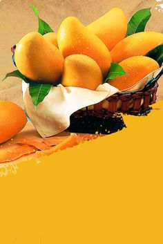 a basket filled with oranges sitting on top of a table