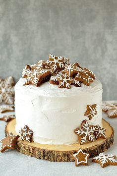 there is a white cake with icing and snowflakes on it