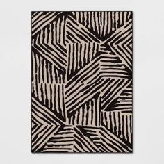 an abstract black and white pattern on a square piece of art that looks like it has been