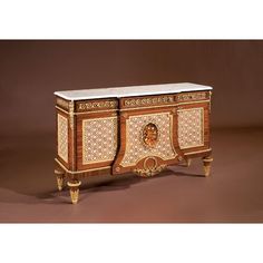 an ornately decorated cabinet with marble top