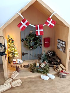 a doll house is decorated with christmas decorations