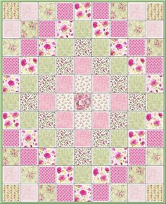 a pink and green patchwork quilt with flowers on the front, in different colors