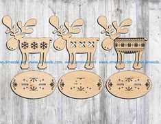 wooden cutouts of reindeers and snowflakes are shown on a wood background