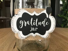 a mason jar with a chalkboard label that says gratude jar on it