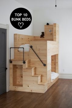 there is a wooden bunk bed with stairs