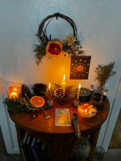 a wooden table topped with lots of candles