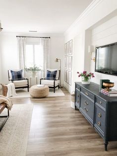 the living room is clean and ready for guests to use it as an entertainment center