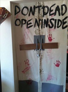 a door decorated with handprints and the words don't dead open inside