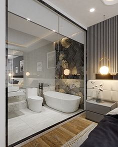 a bathroom with a tub, toilet and sink in it's glass wall area