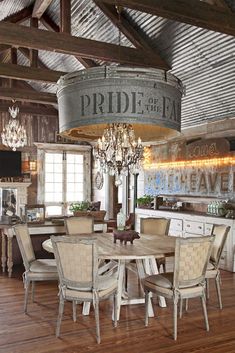 the dining room table is surrounded by chairs and chandelier