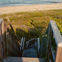 stairs lead down to the beach and ocean