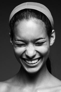 black and white photograph of a smiling woman