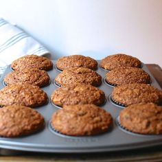 muffins are sitting on a tray ready to be baked