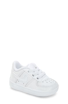 Easy-on/stay-on elastic lacing and a plush terry interior make this Air Force 1–inspired crib shoe as sporty is it is comfy. The wide, flat base helps promote balance and confident early steps when your little sportster begins to walk. Sits on a wide, flat base to help promote balance and confident early steps for beginning walkers Slip-on style with elastic laces Leather upper/textile and synthetic lining/synthetic sole Imported Baby Jordan Shoes, Baby Nike Shoes, Tenis Air Force, Unisex Shoes Sneakers, Shoes For Toddlers, Crib Shoe, Baby Boy Nike, Nike Shoes For Boys, Kids Street Style