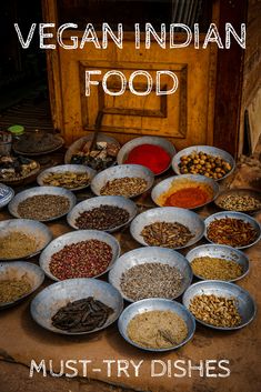 many bowls filled with different types of spices