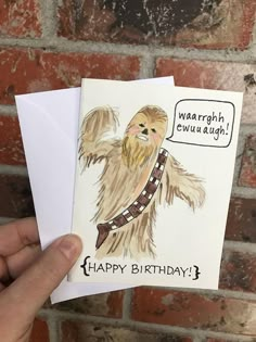 a hand holding up a card with a drawing of a chewy bear on it