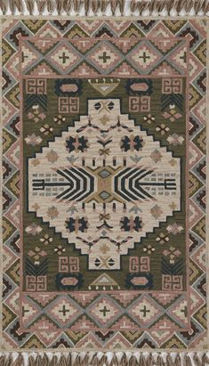 a rug with an intricate design and fringes on the bottom, in various colors