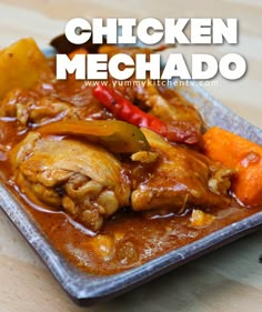 the chicken mechado is served with carrots and potatoes