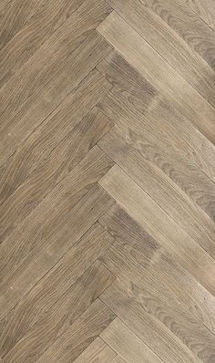 an image of wood flooring that looks like herringbones