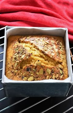 a loaf of bread sitting on top of a metal rack