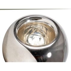 a stainless steel bowl is shown on a white background with the reflection of an object in it