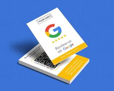 two yellow and white business cards with qr code printed on the front one is for google