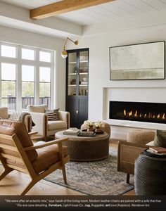 a living room filled with furniture and a fire place in the middle of the room