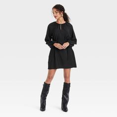 Get ready for any occasion in chic style with this Balloon Long-Sleeve Belted Mini Dress from A New Day™. Made from a midweight rayon-nylon blend for comfortable wear, the pullover dress is fashioned in solid shade with a mini-length silhouette. It features a shirred neckline with a keyhole-front accent, balloon long sleeves with raglan shoulders and a slim fabric belt for cinching your waist with a flattering fit. Simply pair it with your favorite footwear to complete the look. A New Day™: Styl