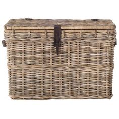 an empty wicker basket with leather handles on a white background for use as a storage container