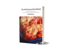 the polish housewife cookbook is shown in front of a blue bowl with tomatoes on it