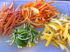 several different types of vegetables cut up on a cutting board