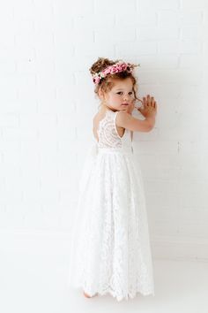 "This stunning dress is a beautiful vintage inspired look...perfect for any little girl and occasion! This white dress has a boho flair and a super feminine feel with the soft vintage inspired lace. The V back with unfinished lace and hem creates the perfect amount of bohemian vibes. It also includes a rhinestone belt sash that is removable. Nicolette's Couture is a family owned boutique based out of Dubuque, Iowa. When creating looks, comfort is our main priority...regardless of how chic a styl Outdoor Wedding Attire, White Tulle Wedding Dress, Wedding Dress Rustic, Flower Girl Dress White, Ophelia Dress, Diy Wedding Photo Booth, Girl Dress White, Wedding Dress Beach Wedding, Wedding Dress Beach