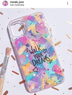 a phone case with the words walk your dreams on it next to a brush and confetti