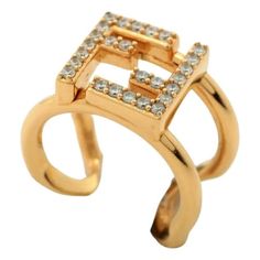 Elevate your style with the iconic Fendi FF Anello Gold and Crystal Embellished Ring, featuring crystal FF on gold-finish metal. This classic ring includes engraved decoration in the F is Fendi shape and decorated with natural crystals. Fashion-forward and elegant, this ring makes the perfect finish for any outfit. Gift this gorgeous ring or add it to your personal designer collection, only from Fendi. Model: 8AH246 Size: Large (US Size 8) Gold-finished metal FF logo Decorated with natural cryst Classic Ring, Gold Finish, Natural Crystals, Designer Collection, Types Of Metal, Fashion Forward, Fendi, Jewelry Design, Crystals