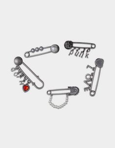 several different types of piercings on a white background with the word punk written in silver