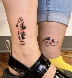 two people with matching tattoos on their feet, one has a fish and the other has a fish