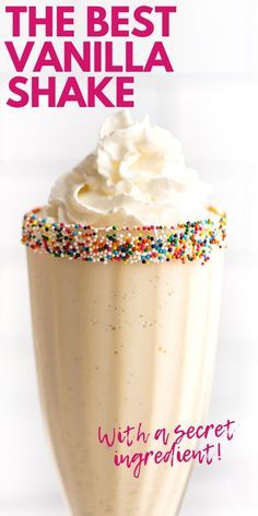 the best vanilla shake with a sprinkle and whipped cream on top is shown