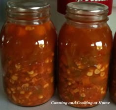 three jars filled with food sitting on top of a counter