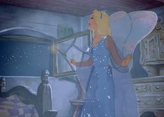 an animated image of a woman dressed in blue holding a wand and wearing a fairy costume