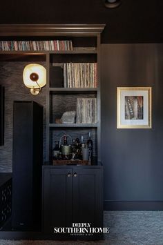 a room with a book shelf and shelves full of books on the wall next to it